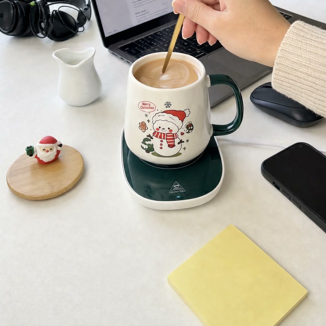 Merry Sips on the warmer at the desk
